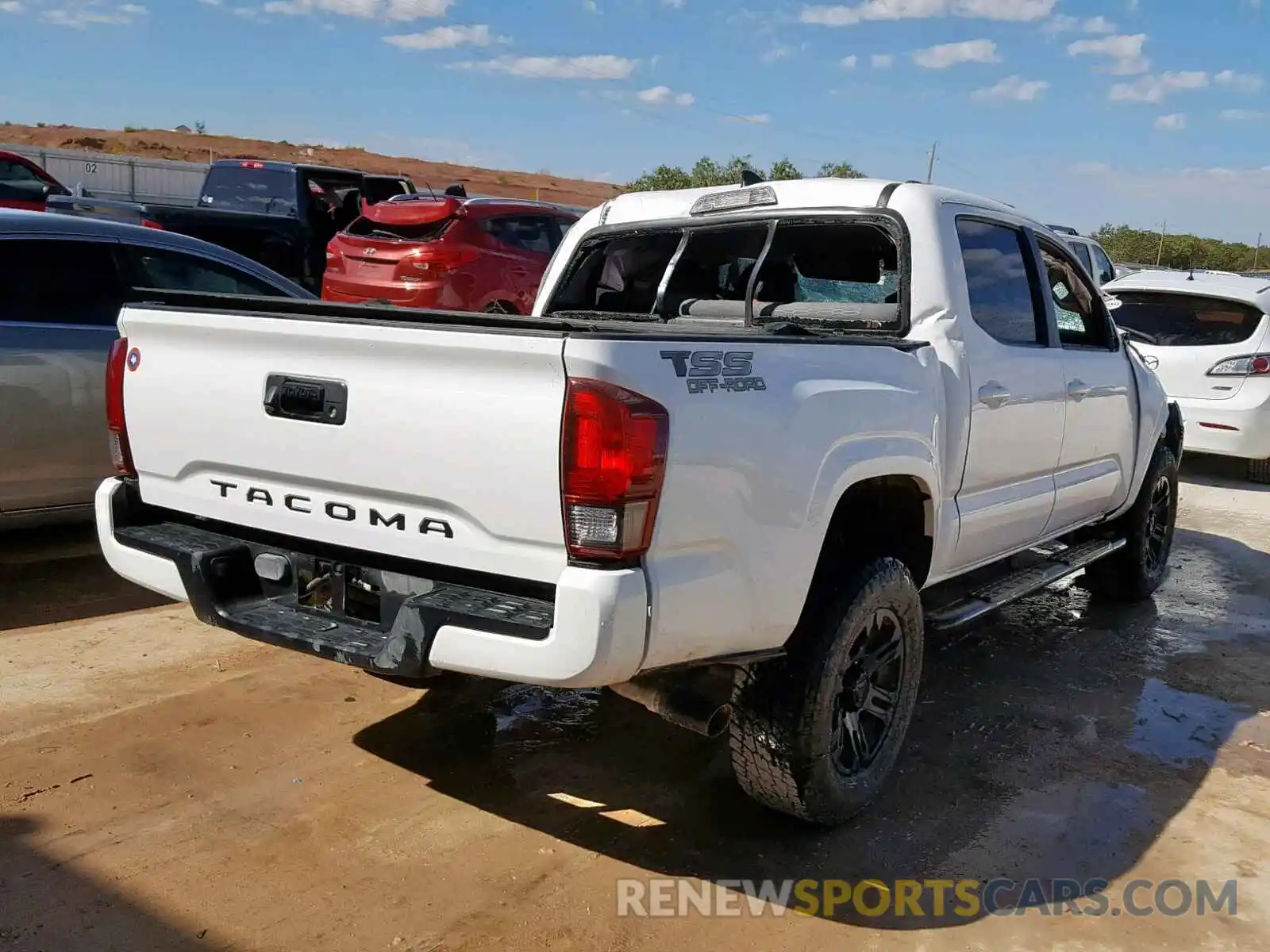 4 Photograph of a damaged car 5TFAX5GN5KX140876 TOYOTA TACOMA DOU 2019