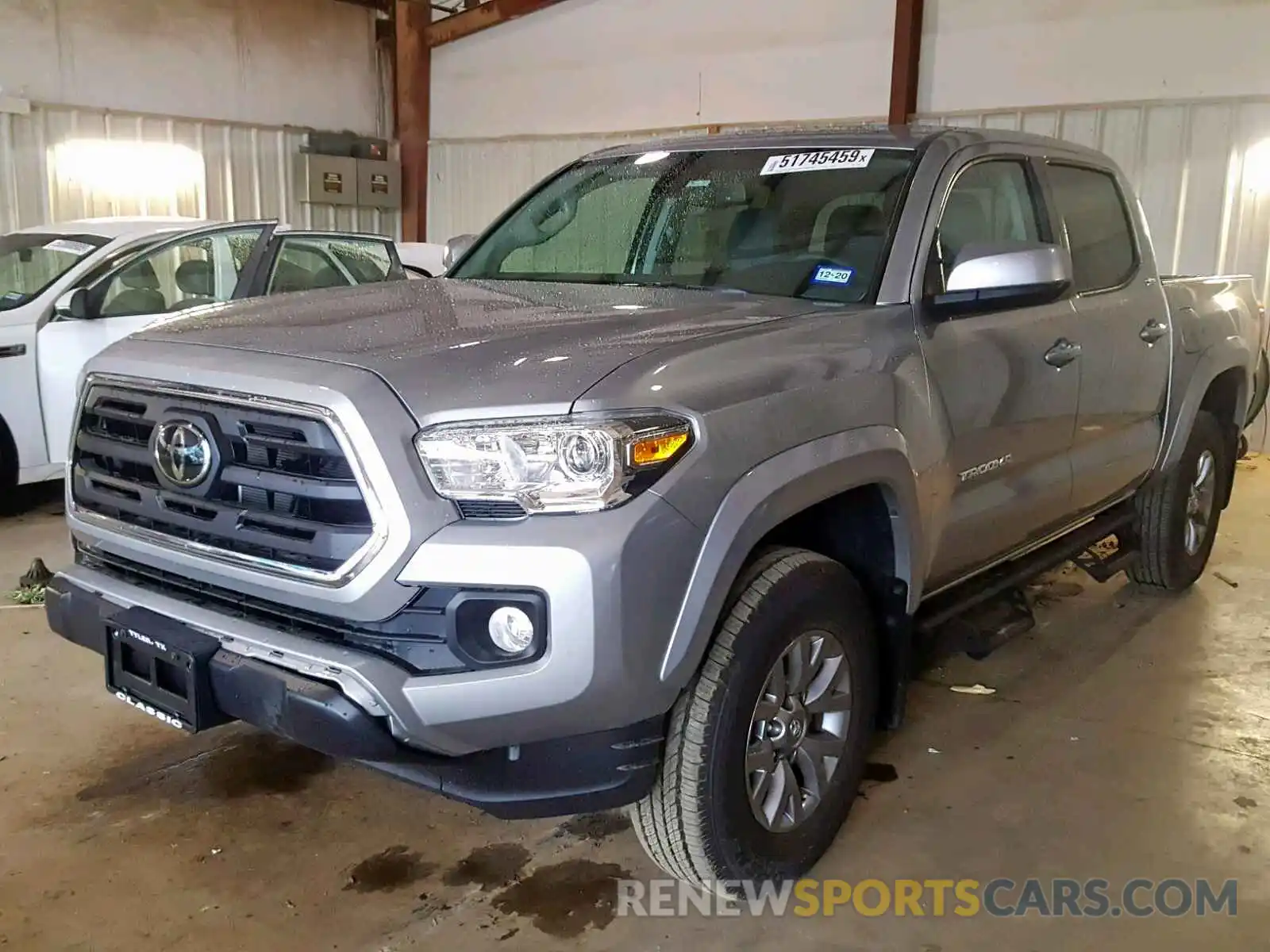 2 Photograph of a damaged car 5TFAZ5CN2KX077932 TOYOTA TACOMA DOU 2019