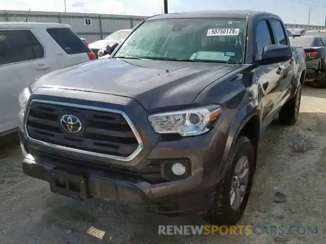 2 Photograph of a damaged car 5TFAZ5CN7KX077246 TOYOTA TACOMA DOU 2019