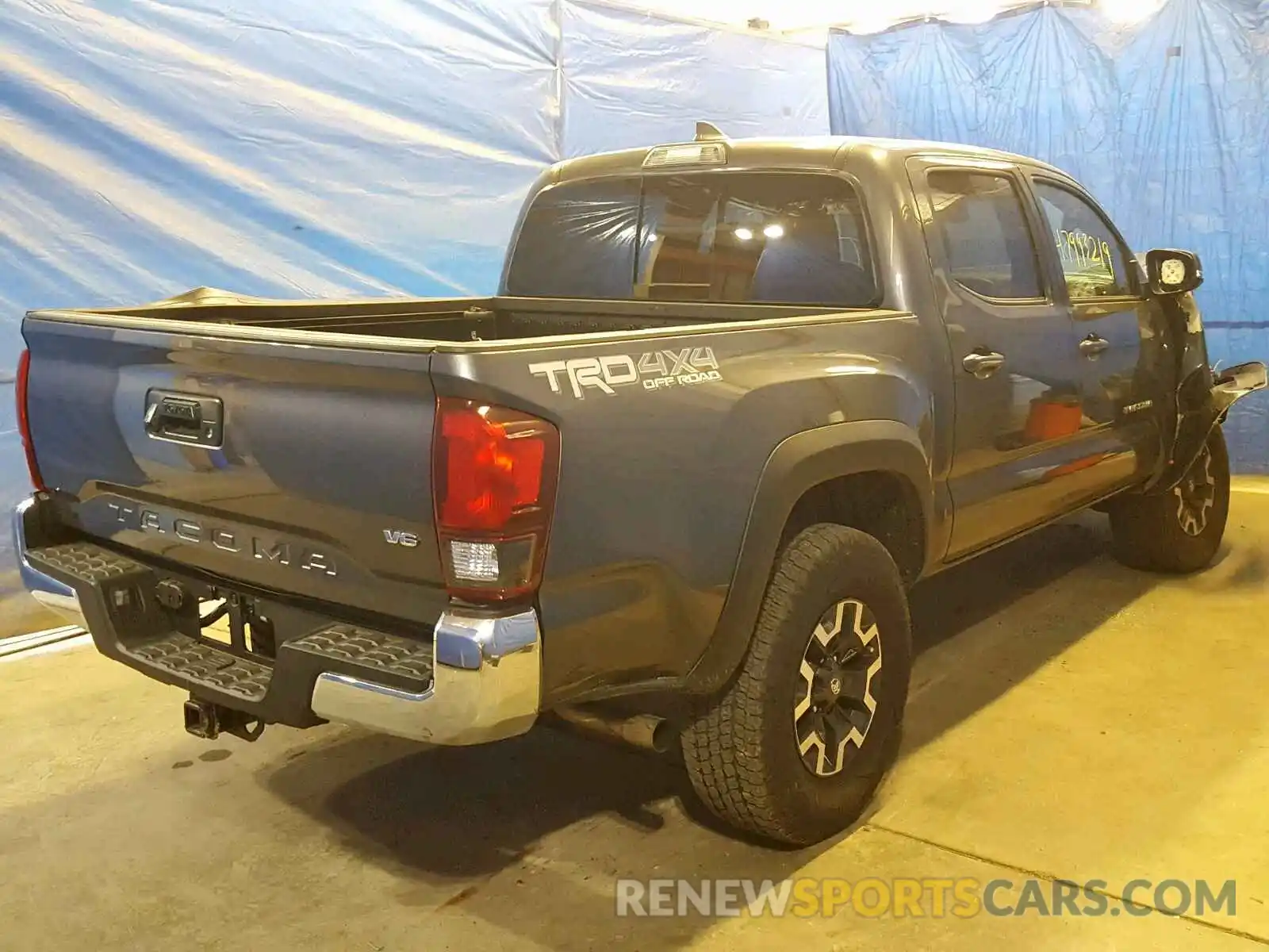 4 Photograph of a damaged car 5TFCZ5AN3KX186802 TOYOTA TACOMA DOU 2019